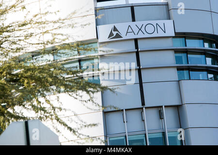 A logo sign outside of the headquarters of Axon in Scottsdale, Arizona, on February 4, 2018. Stock Photo