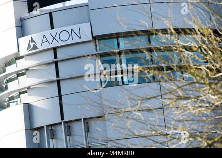 A logo sign outside of the headquarters of Axon in Scottsdale, Arizona, on February 4, 2018. Stock Photo