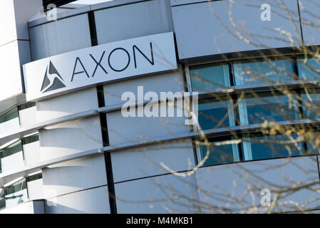 A logo sign outside of the headquarters of Axon in Scottsdale, Arizona, on February 4, 2018. Stock Photo