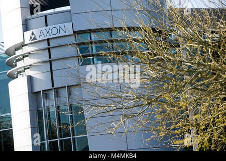 A logo sign outside of the headquarters of Axon in Scottsdale, Arizona, on February 4, 2018. Stock Photo