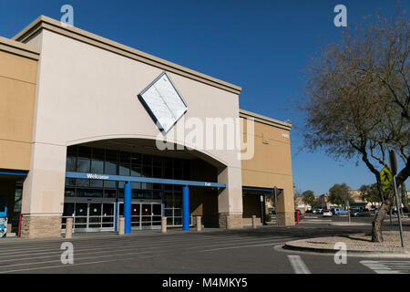 The outline of a logo sign outside of a recently closed Sam's Club warehouse club store in Scottsdale, Arizona, on February 4, 2018. Stock Photo