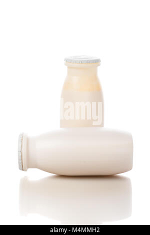 Two bottles of yogurt isolated on white background Stock Photo