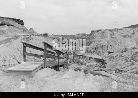 Wooden stairway leading to campground in Dinosaur Provincial Park, Alberta, Canada in monochrome; a UNESCO World Heritage Site Stock Photo