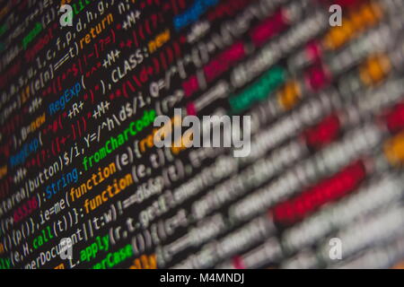 Colorful Program Source Code Segment on Black Screen Closeup Stock Photo