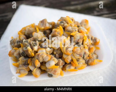 A takeaway plate of Cockles from a seafood stall from Old Leigh in Essex Stock Photo