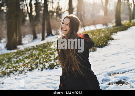 Happy girl enjoying winter. Portrait of a caucasian girl laughing Stock Photo