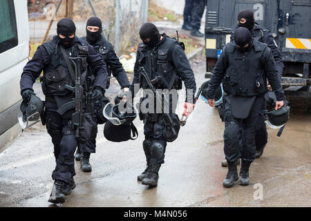 Special law enforcement unit. Special police force units in uniforms, bulletproof vests, firearms and guns. Masked police officers. Special Assault Te Stock Photo