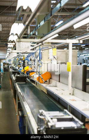conveyor belt of assembly line for office equipment in factory Stock Photo