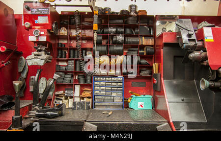 High Street shoe repair desk, work, old, shoemaker, tools, footwear, equipment, style, industry, hand, machine,and counter for repairs. UK Stock Photo