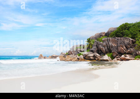 Beautiful tropical  sand beach with granite rocks. Beach Grand Anse, La Digue, Seychelles. Stock Photo