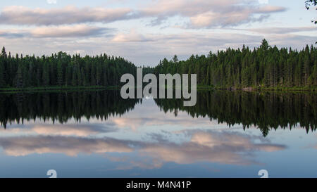 Beautiful sky reflection on a lake in Quebec, Canada Stock Photo