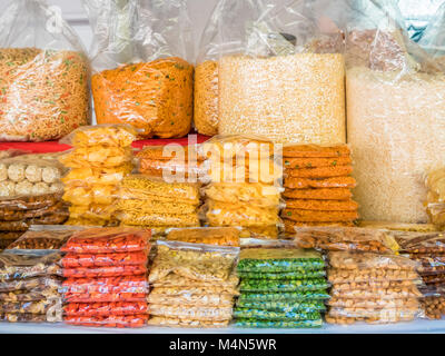 Variety types of Indian snacks selling in the shop. Stock Photo