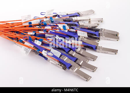 Bunch of Fiber optics cables, isolated on white background. Stock Photo