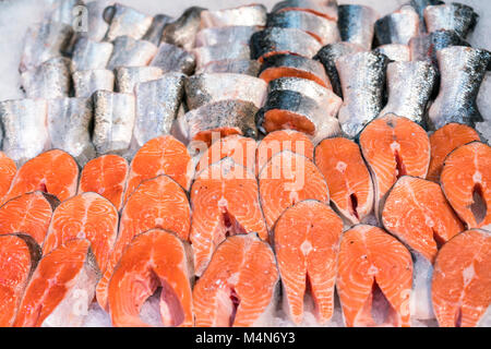 Salmon Fillet in Ice on the supermarket counter Stock Photo