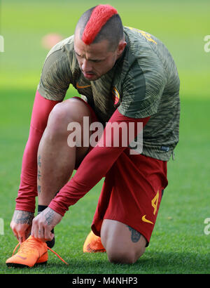 Udine, Italy. 17th Feb, 2018. Roma's midfielder Radja Nainggolan checks his shoes during the Serie A football match between Udinese Calcio v AS Roma at Dacia Arena Stadium on 17th February, 2018. Credit: Andrea Spinelli/Alamy Live News Stock Photo