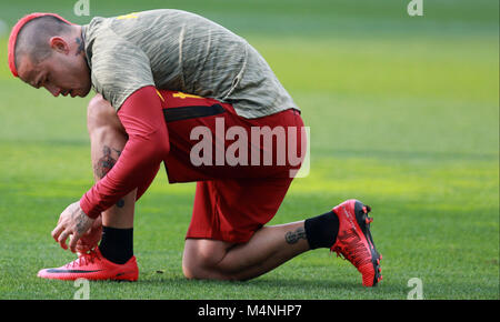 Udine, Italy. 17th Feb, 2018. Roma's midfielder Radja Nainggolan checks his shoes during the Serie A football match between Udinese Calcio v AS Roma at Dacia Arena Stadium on 17th February, 2018. Credit: Andrea Spinelli/Alamy Live News Stock Photo