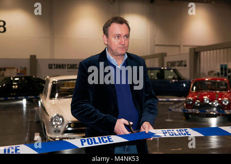 Actor, Philip Glenister cutting a ribbon, to open 'Getaway Cars' a lineup of getaway cars from film and real life, that he curated for 'The 2018, London Classic Car Show' Stock Photo