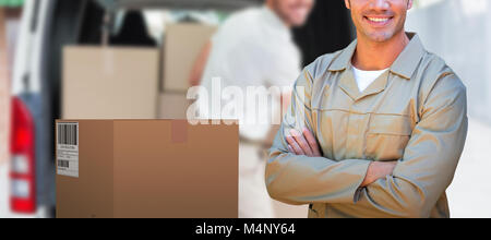Composite 3d image of confident delivery man standing with arms crossed Stock Photo