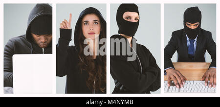 Composite image of focused male hacker using laptop Stock Photo