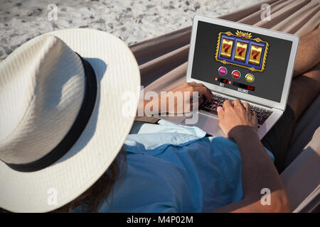 Composite image of slot machine with icons and symbols on mobile screen Stock Photo