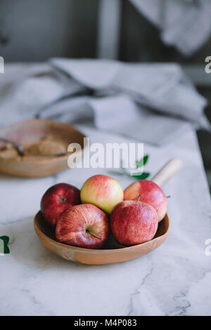 Various red and green apples in a fruit bowl Stock Photo