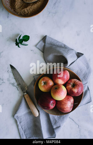 Various red and green apples in a fruit bowl Stock Photo