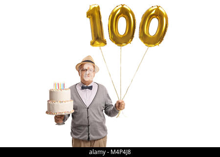 Mature man holding a birthday cake and golden number hundred balloon isolated on white background Stock Photo