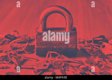 Security concept with lock and keys on the wooden table in duotone toned hipster style Stock Photo