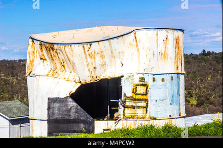 Old Rusted Water Tank With Caved In Side Stock Photo