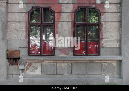 Two old dirty window on old wall Stock Photo