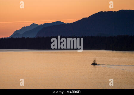 Fishing boat heading to sea from Juneau, Alaska. Stock Photo
