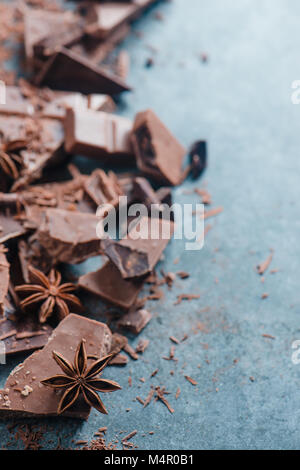 Chocolate pieces in a border with copy space. Extreme close-up. Confectionery food photography. Stock Photo