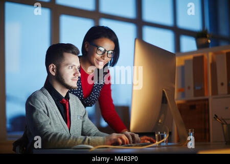 Manager working at night Stock Photo