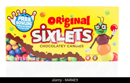 Winneconne, WI - 10 February 2018: A package of original Sixlets chocolatey candies on an isolated background. Stock Photo