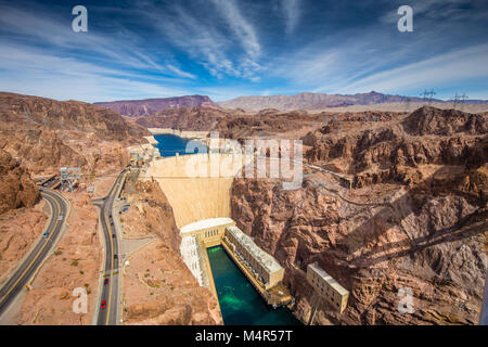 Aerial wide angle view of famous Hoover Dam, a major tourist attraction located on the border between the states of Nevada and Arizona, on a beautiful Stock Photo