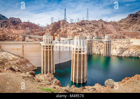 Classic view of famous Hoover Dam, a major tourist attraction located on the border between the states of Nevada and Arizona, on a beautiful sunny day Stock Photo