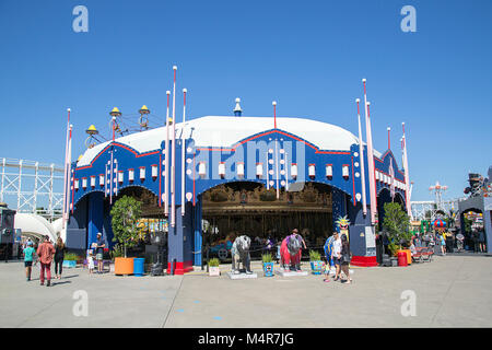 St Kilda, Melbourne, Australia: March 18, 2017: Families enjoying the rides at Melbourne's Luna Park on a blue sky summers day. Stock Photo