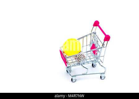 Mini shopping cart or supermarket trolley with yellow tungsten light bulb, isolated on white background, business finance shopping concept idea. Stock Photo