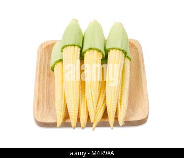 Baby corn on wooden dish isolated on white background, Save clipping path. Stock Photo