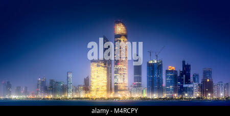 Panorama view of Abu Dhabi Skyline at sunset, UAE Stock Photo