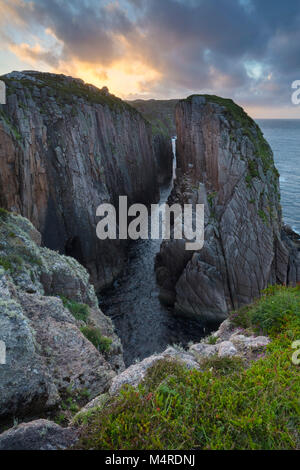 Evening over a coastal chasm on Owey Island, County Donegal, Ireland. Stock Photo