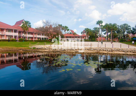 An alligator fence and rock bulkhead at the waterline now protects sand beach guests from any reptile moving through their lakes and canals. Stock Photo