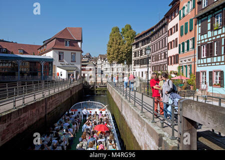 Excursion boat at floodgate of Ill river, half-timber houses, La Petite France (Little France), Strasbourg, Alsace, Bas-Rhin, France, Europe Stock Photo