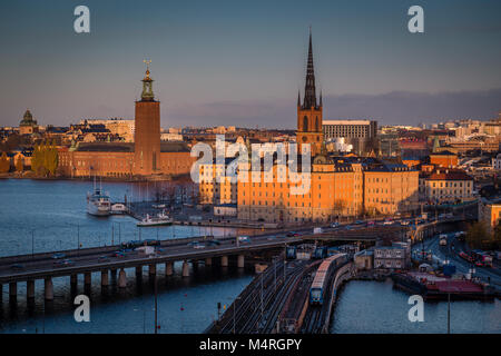 Panoramic view of famous Stockholm city center with historic Riddarholmen in Gamla Stan old town district and Stadshus (town hall) at sunrise, Soderma Stock Photo