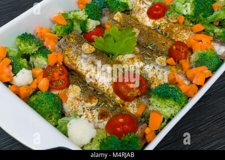 fresh dish filled with vegetables-carrot, broccoli, thyme, garlic Stock Photo