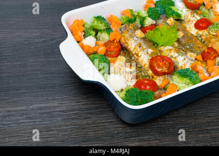 fresh dish filled with vegetables-carrot, broccoli, thyme, garlic Stock Photo