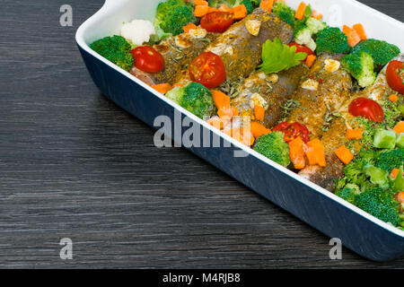fresh dish filled with vegetables-carrot, broccoli, thyme, garlic Stock Photo