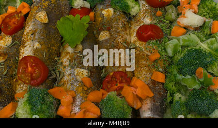 fresh dish filled with vegetables-carrot, broccoli, thyme, garlic Stock Photo