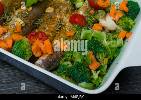 fresh dish filled with vegetables-carrot, broccoli, thyme, garlic Stock Photo