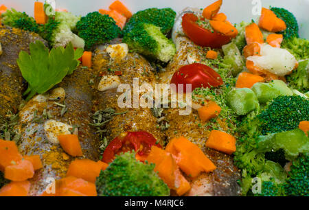 fresh dish filled with vegetables-carrot, broccoli, thyme, garlic Stock Photo